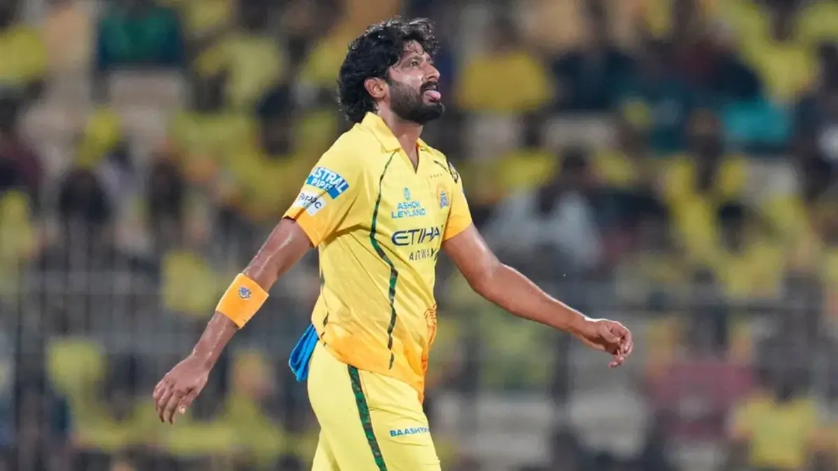 Khaleel Ahmed in Chennai Super Kings uniform, looking stressed, with his tongue out after bowling a delivery.