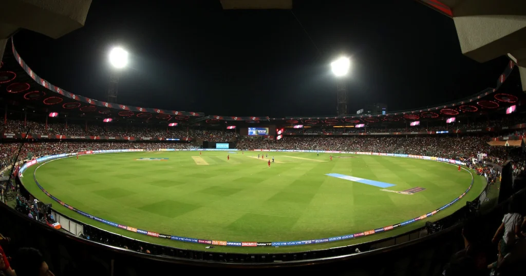Panoramic night view of M. Chinnaswamy Stadium Bengaluru during an IPL 2026 match.
